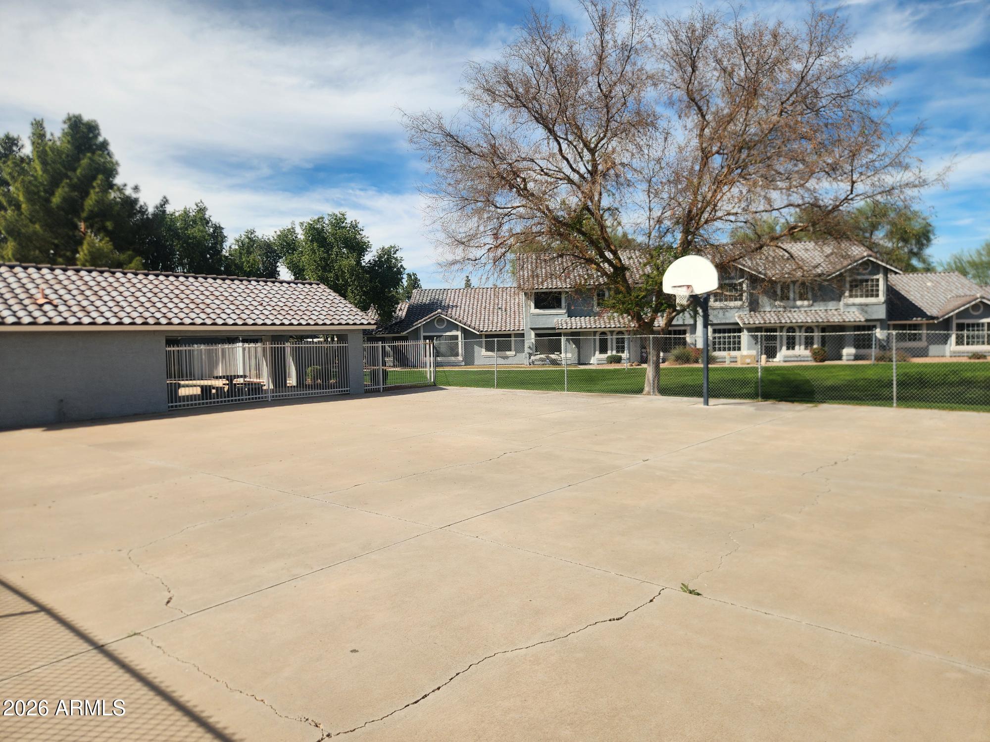 860 North McQueen Road, Unit 1145 Chandler, AZ 85225 - Photo 63 of 63 a view of swimming pool and trees in the background