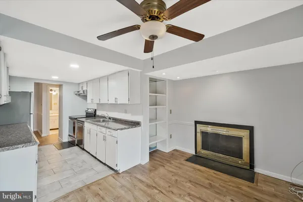 a kitchen with stainless steel appliances a stove sink and refrigerator