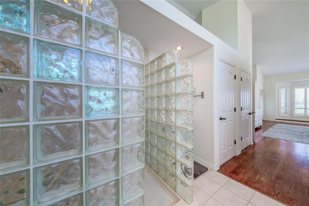 624 South Casey Key Road Nokomis, FL 34275 - Photo 12 of 75 a bathroom with a glass shower door