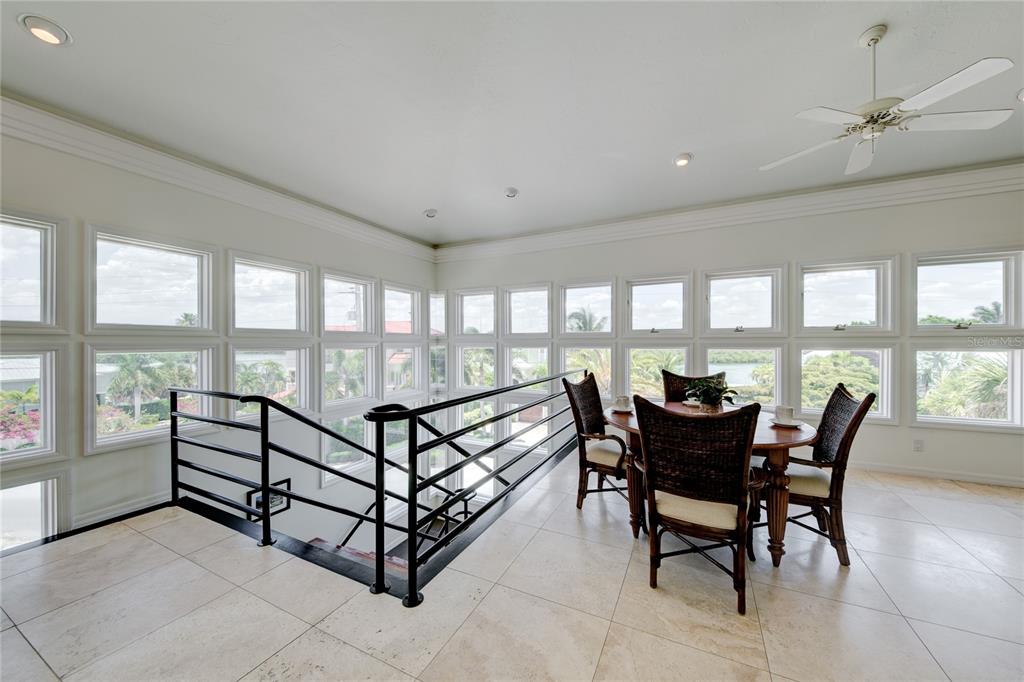 624 South Casey Key Road Nokomis, FL 34275 - Photo 16 of 75 a view of a dining room and livingroom with furniture
