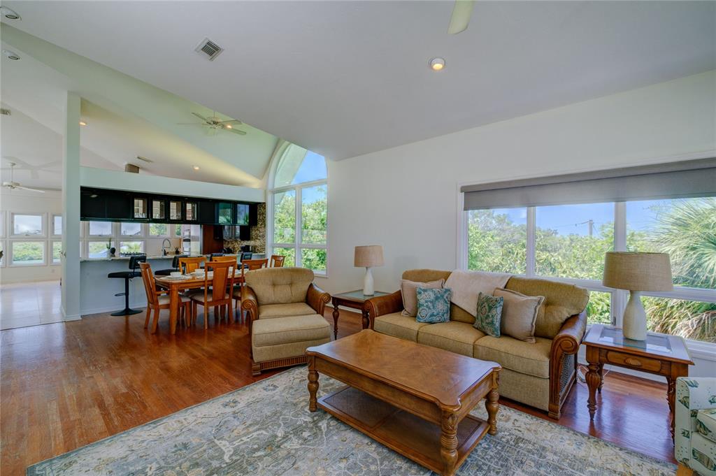 624 South Casey Key Road Nokomis, FL 34275 - Photo 31 of 75 a living room with furniture and a large window