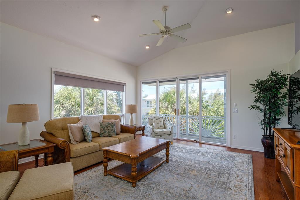 624 South Casey Key Road Nokomis, FL 34275 - Photo 32 of 75 a living room with furniture and a large window