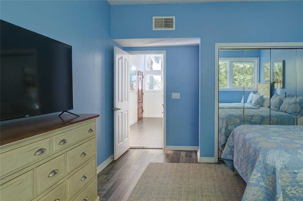 624 South Casey Key Road Nokomis, FL 34275 - Photo 38 of 75 a living room with furniture and a flat screen tv
