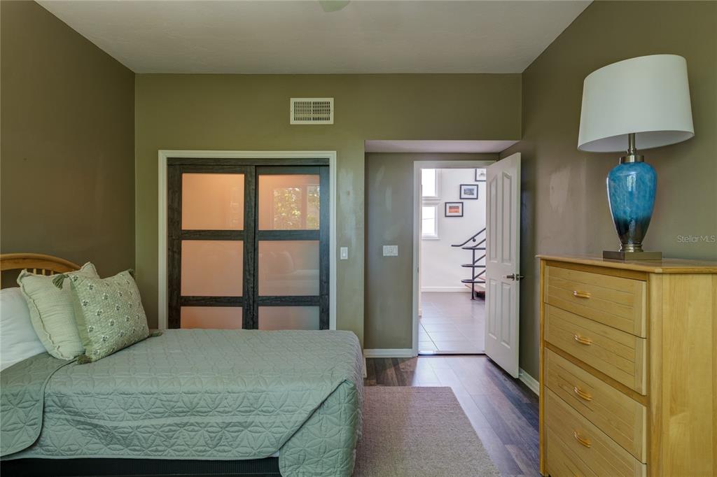 624 South Casey Key Road Nokomis, FL 34275 - Photo 41 of 75 a bedroom with a bed and a window