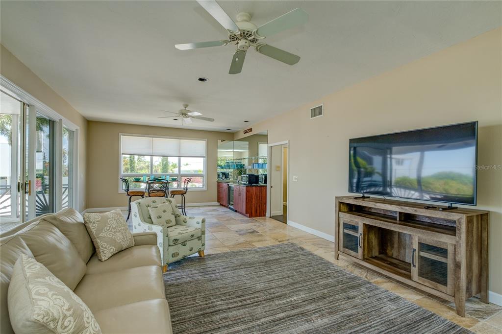 624 South Casey Key Road Nokomis, FL 34275 - Photo 42 of 75 a living room with furniture and a fireplace
