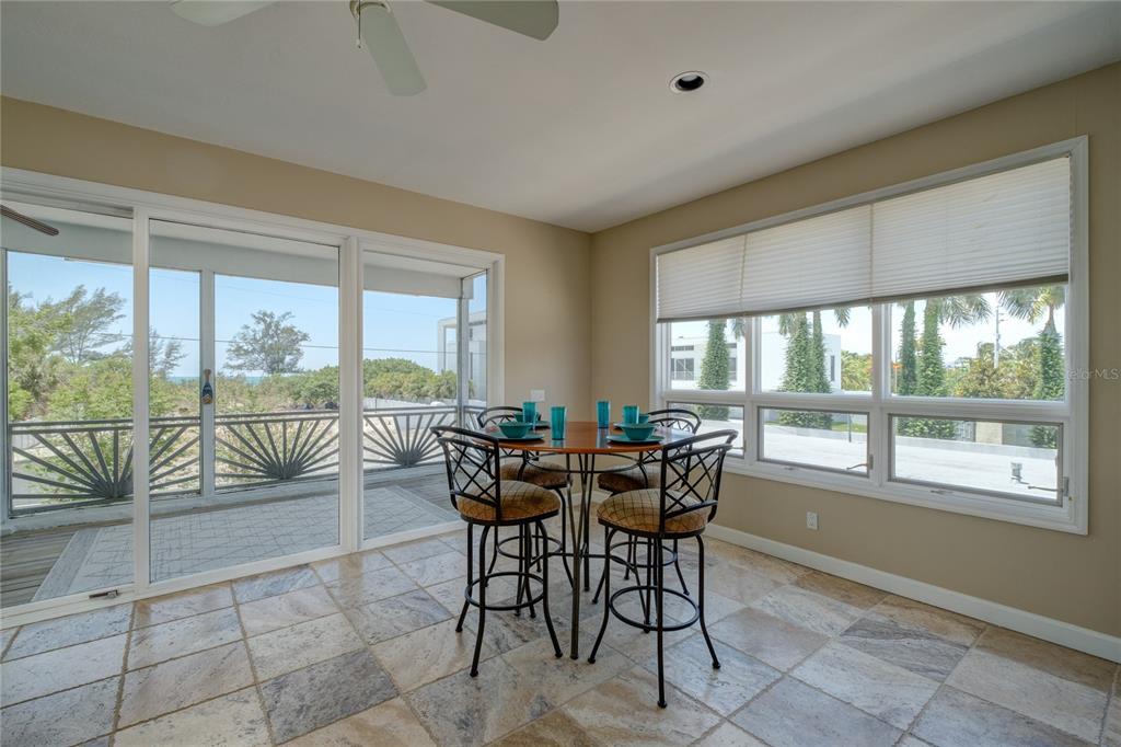 624 South Casey Key Road Nokomis, FL 34275 - Photo 43 of 75 a view of a dining room with furniture window and outside view