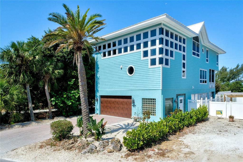 624 South Casey Key Road Nokomis, FL 34275 - Photo 59 of 75 a front view of a house with a yard