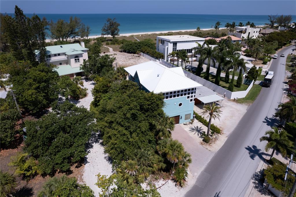 624 South Casey Key Road Nokomis, FL 34275 - Photo 64 of 75 an aerial view of residential houses with outdoor space