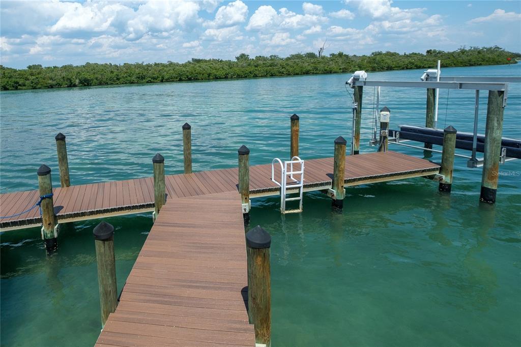 624 South Casey Key Road Nokomis, FL 34275 - Photo 72 of 75 a view of a lake with seating area and lake view