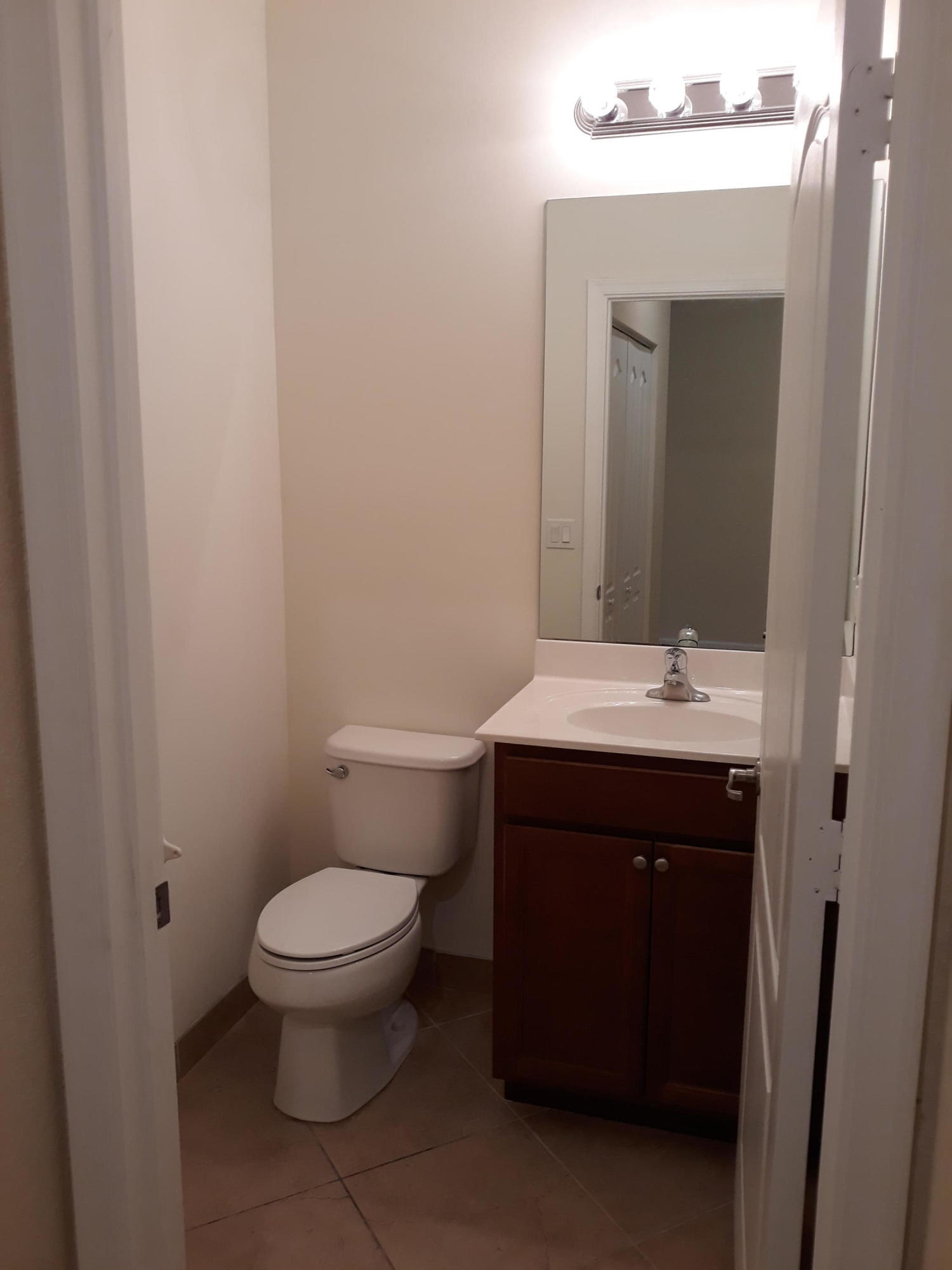 9673 Southwest Purple Martin Way Stuart, FL 34997 - Photo 5 of 15 First Floor Half Bathroom