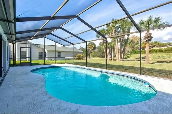a view of a swimming pool with an outdoor seating