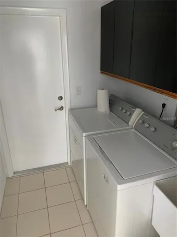a utility room with washer and dryer