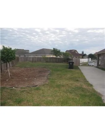 a view of a lake with houses in the background