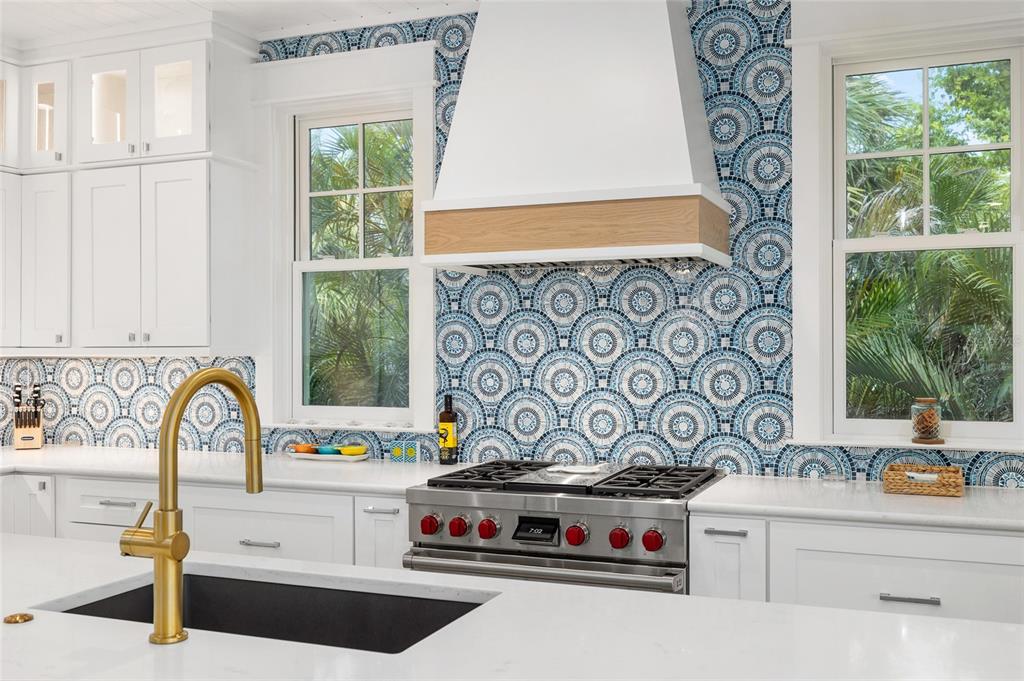 180 Damfiwill Street Boca Grande, FL 33921 - Photo 19 of 83 a kitchen with a stove a sink and a window