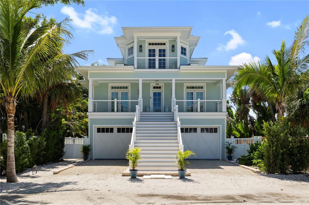 180 Damfiwill Street Boca Grande, FL 33921 - Photo 2 of 83 a front view of a house with a yard