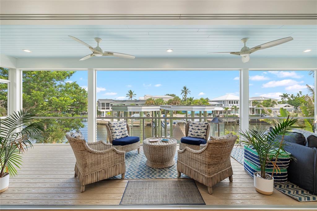 180 Damfiwill Street Boca Grande, FL 33921 - Photo 21 of 83 a living room with patio furniture and a potted plants