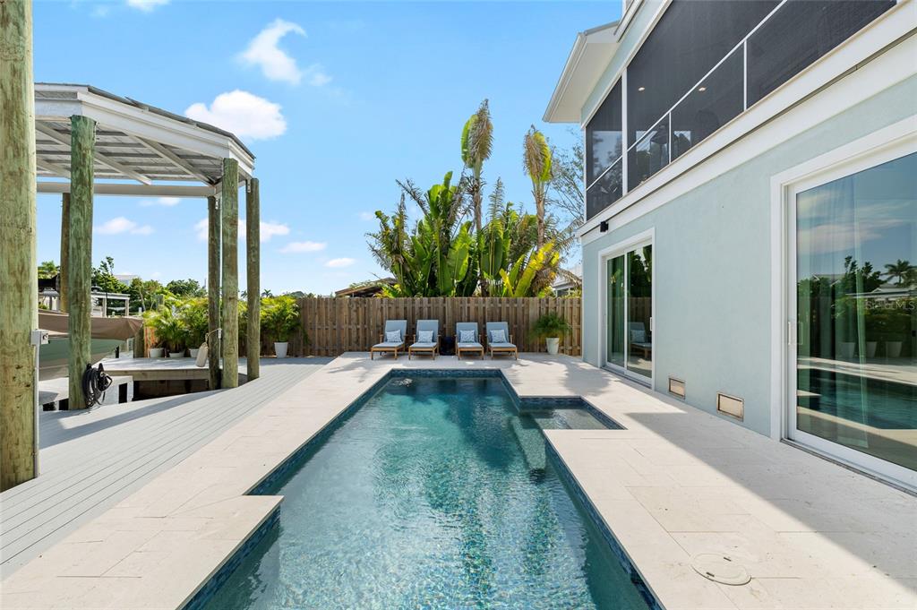 180 Damfiwill Street Boca Grande, FL 33921 - Photo 29 of 83 a view of a house with backyard and sitting area