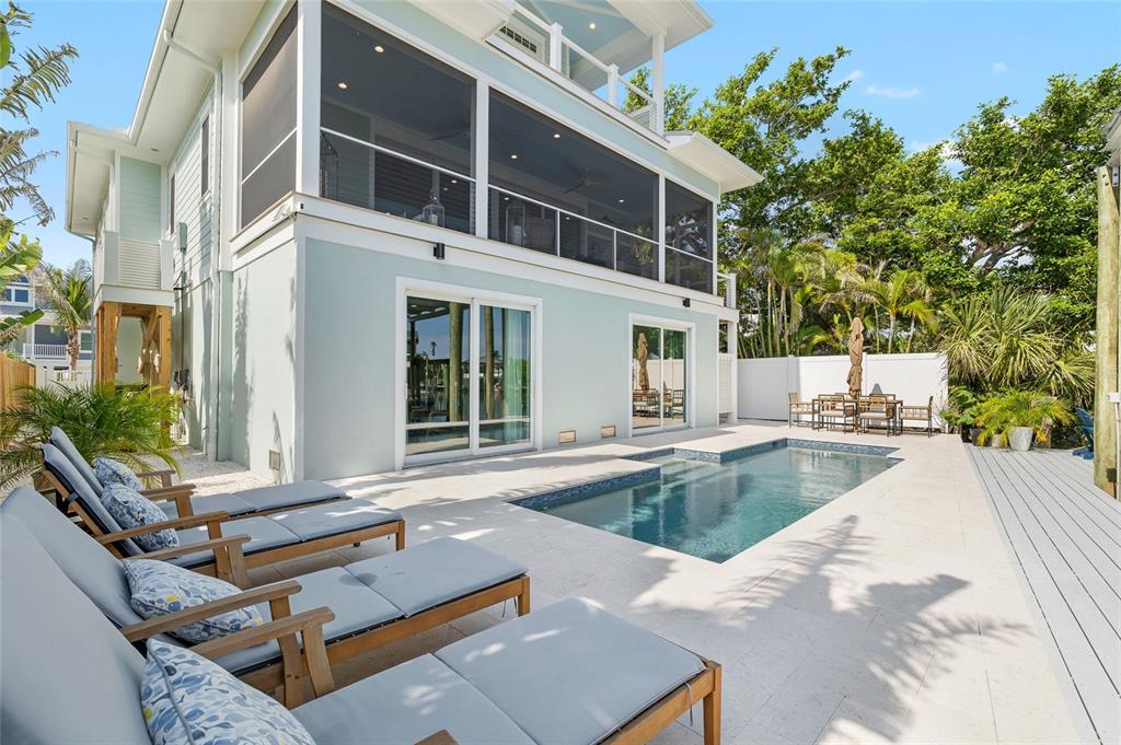 180 Damfiwill Street Boca Grande, FL 33921 - Photo 32 of 83 a view of a house with pool and sitting area