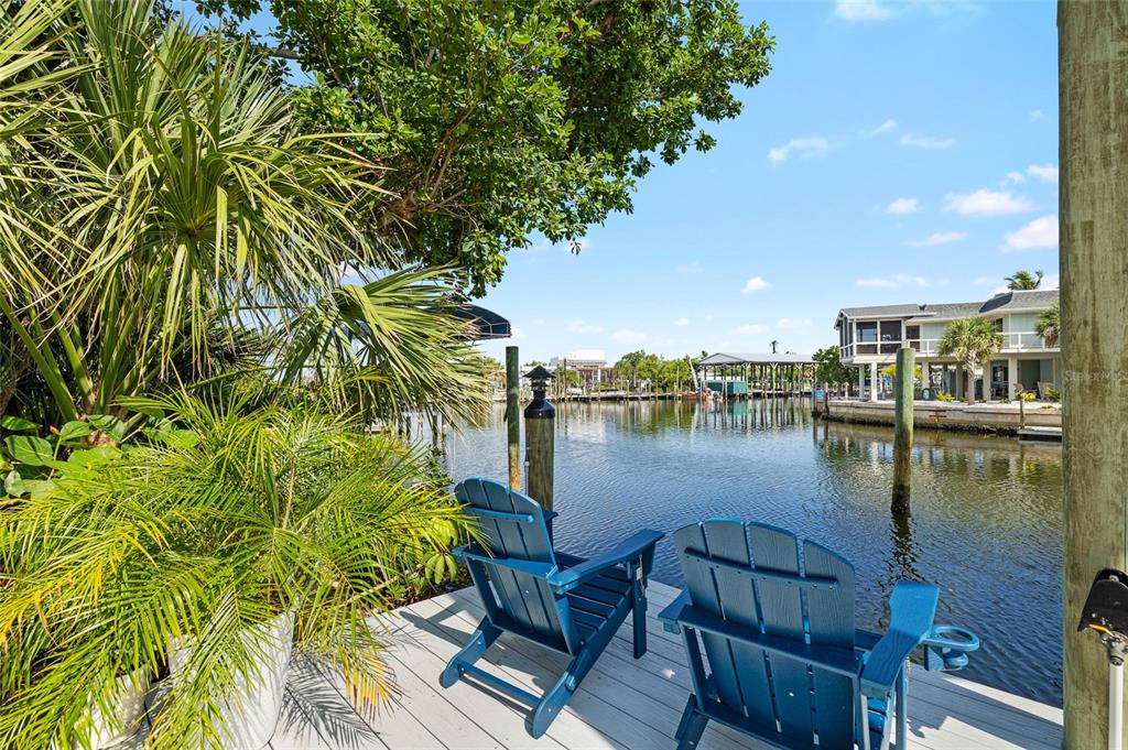 180 Damfiwill Street Boca Grande, FL 33921 - Photo 38 of 83 a view of a lake with table and chairs