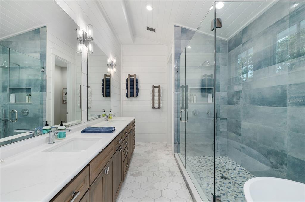 180 Damfiwill Street Boca Grande, FL 33921 - Photo 46 of 83 a bathroom with a double vanity sink toilet and shower