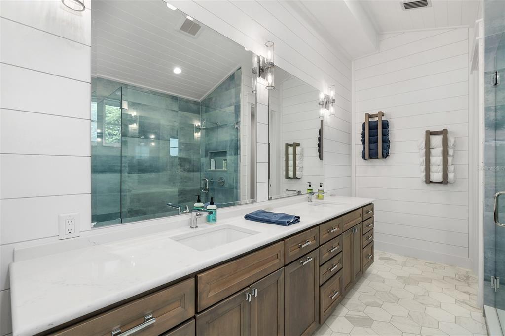 180 Damfiwill Street Boca Grande, FL 33921 - Photo 47 of 83 a bathroom with a sink double vanity and shower