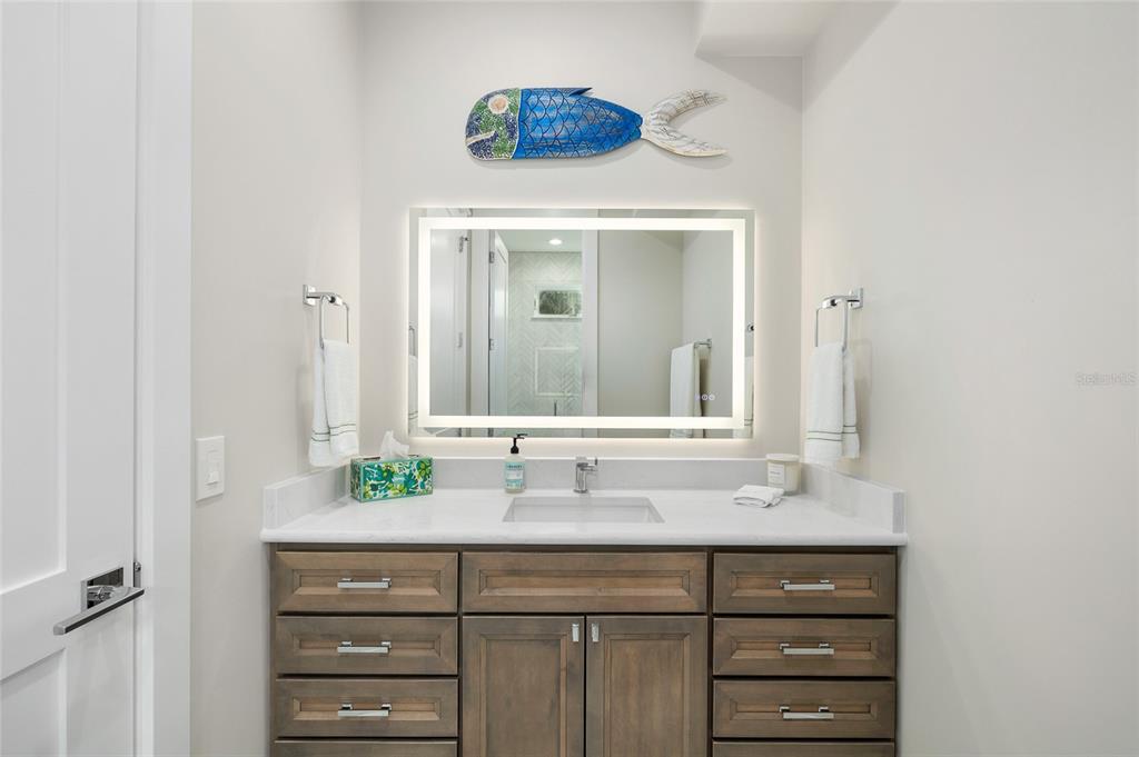 180 Damfiwill Street Boca Grande, FL 33921 - Photo 55 of 83 a bathroom with a sink and a mirror
