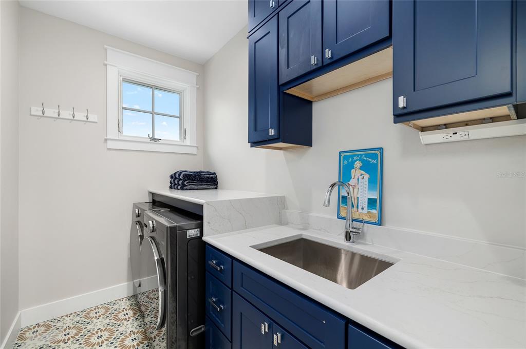 180 Damfiwill Street Boca Grande, FL 33921 - Photo 57 of 83 a kitchen with stainless steel appliances granite countertop a sink stove and cabinets