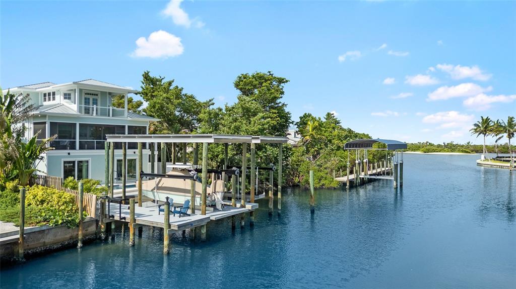 180 Damfiwill Street Boca Grande, FL 33921 - Photo 73 of 83 a view of a chairs and table in a patio