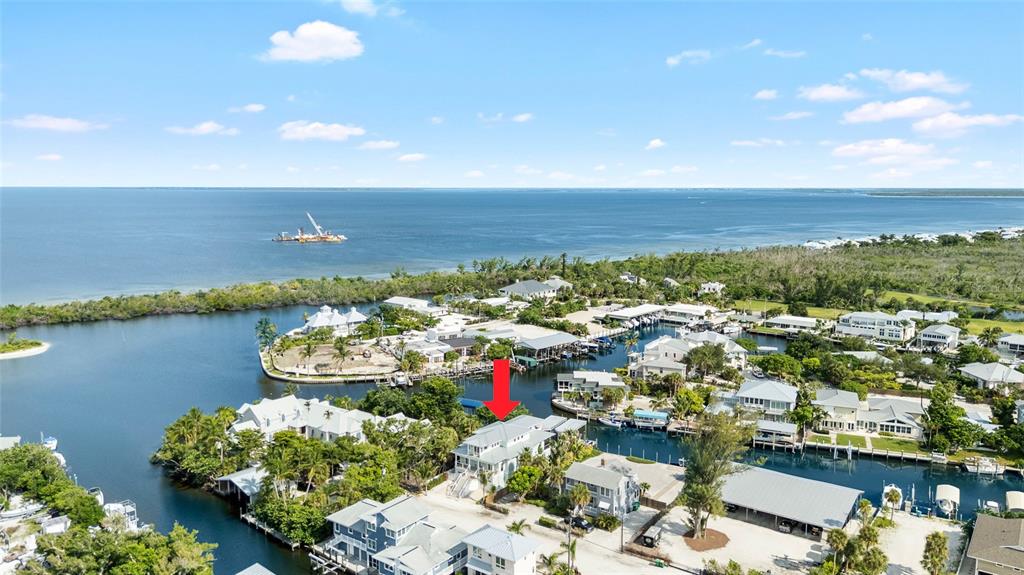 180 Damfiwill Street Boca Grande, FL 33921 - Photo 77 of 83 an aerial view of a house with a lake view