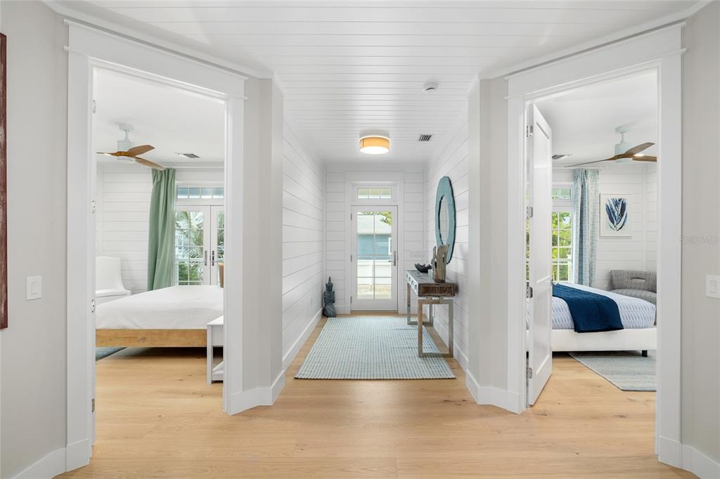 180 Damfiwill Street Boca Grande, FL 33921 - Photo 10 of 83 a view of a bedroom with a bed and glass door