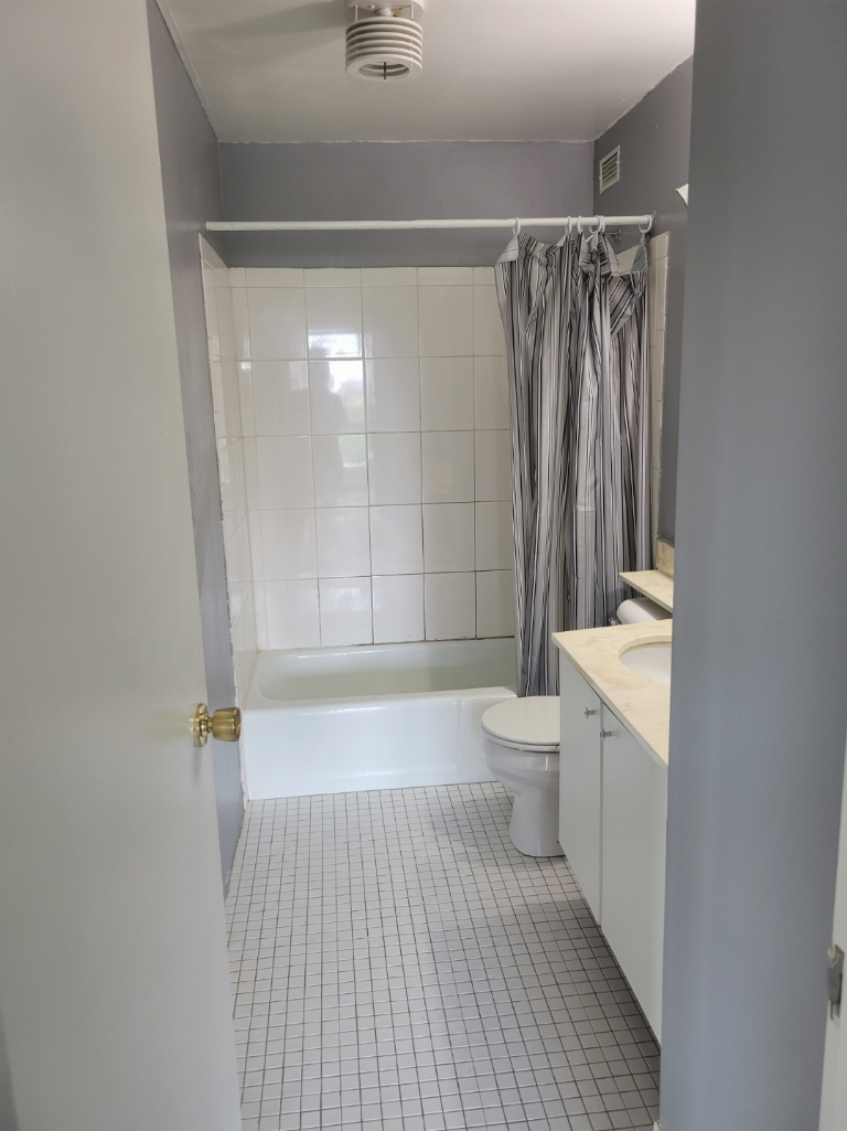 5415 North Sheridan Road, Unit 609 Chicago, IL 60640 - Photo 18 of 25 a bathroom with a shower a toilet and a shower