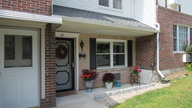 a front view of a house with a porch
