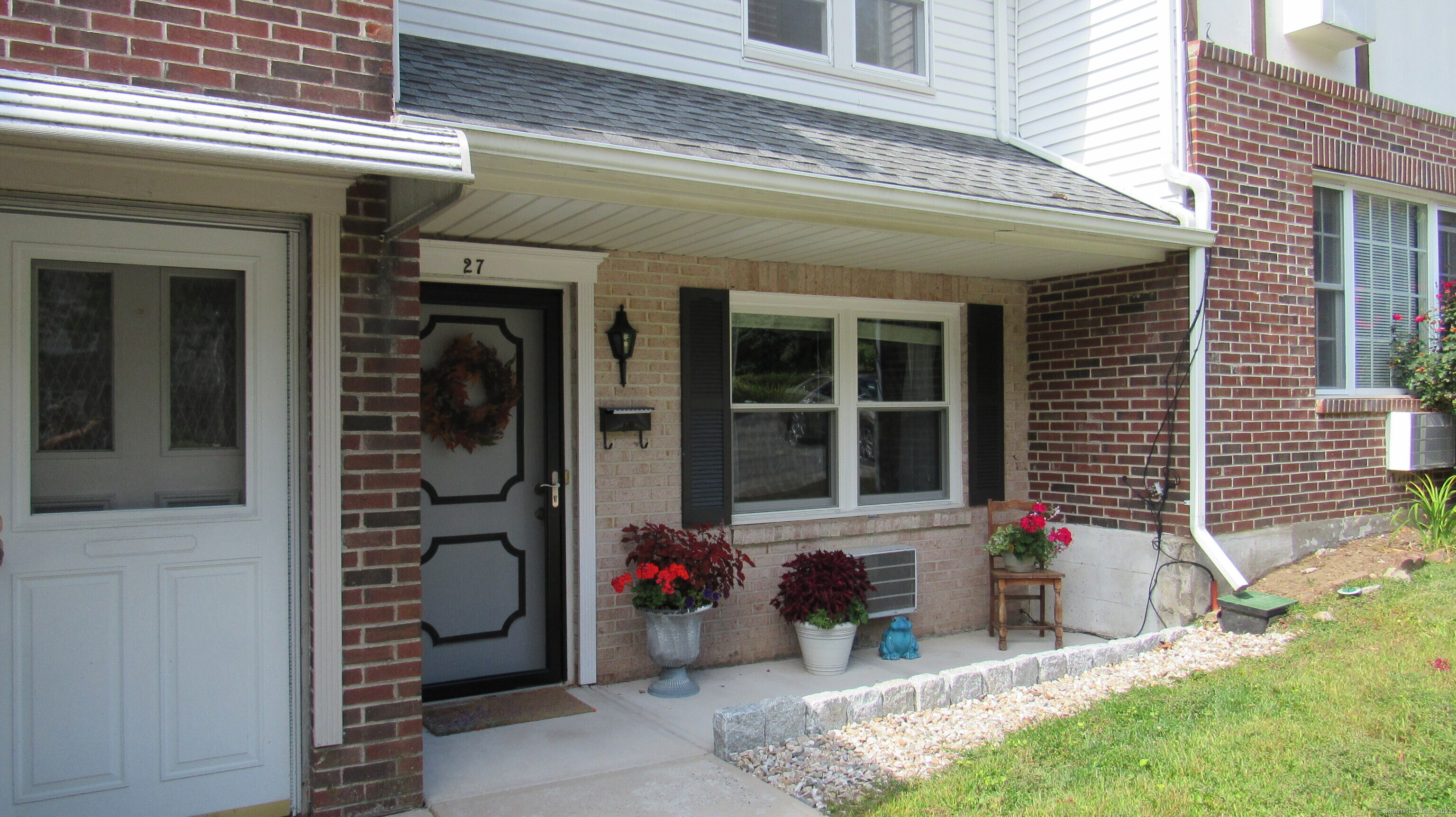 a front view of a house with a porch
