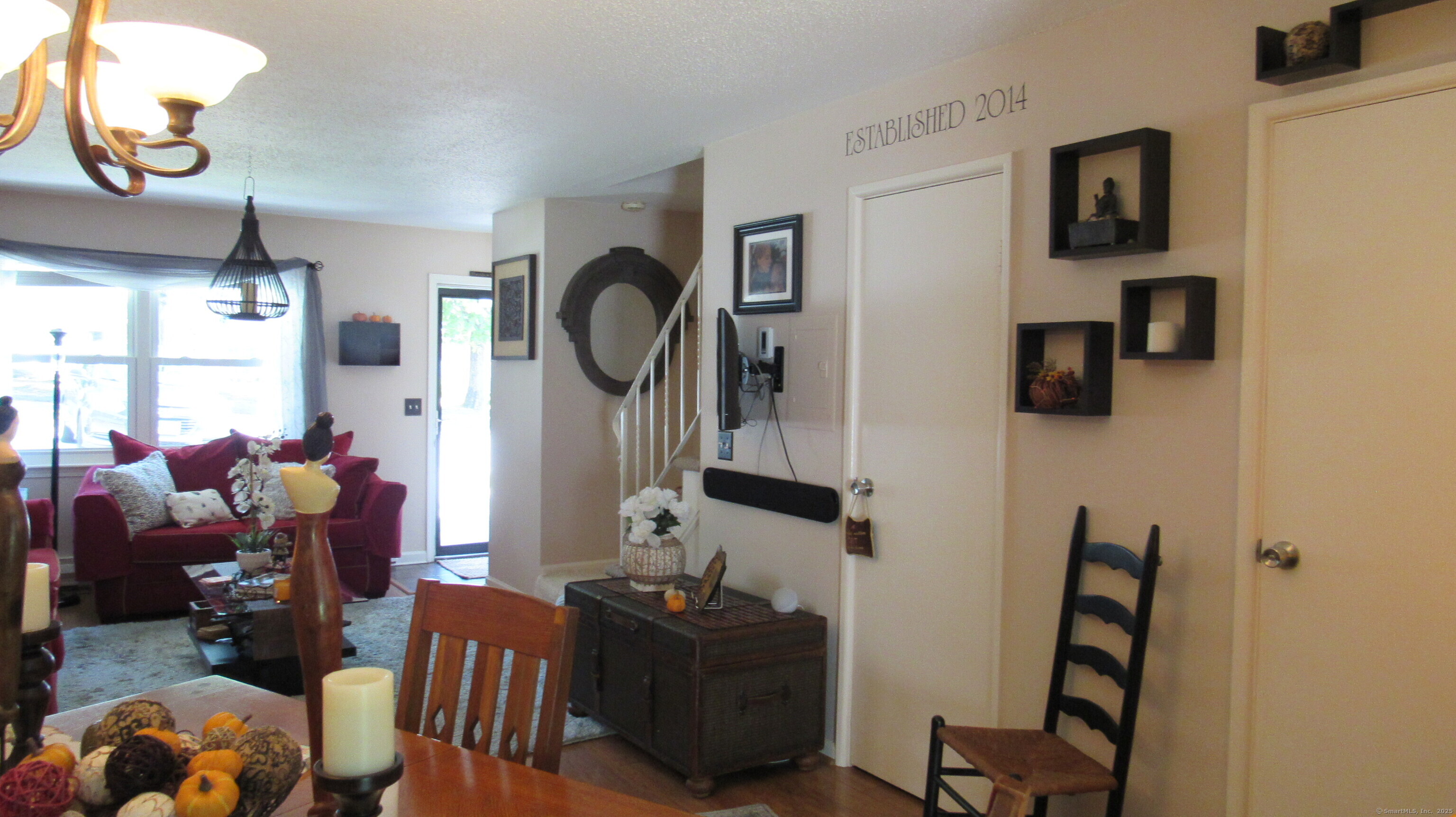 27 Surrey Lane, Unit 27 Torrington, CT 06790 - Photo 15 of 30 a living room with furniture and a mirror