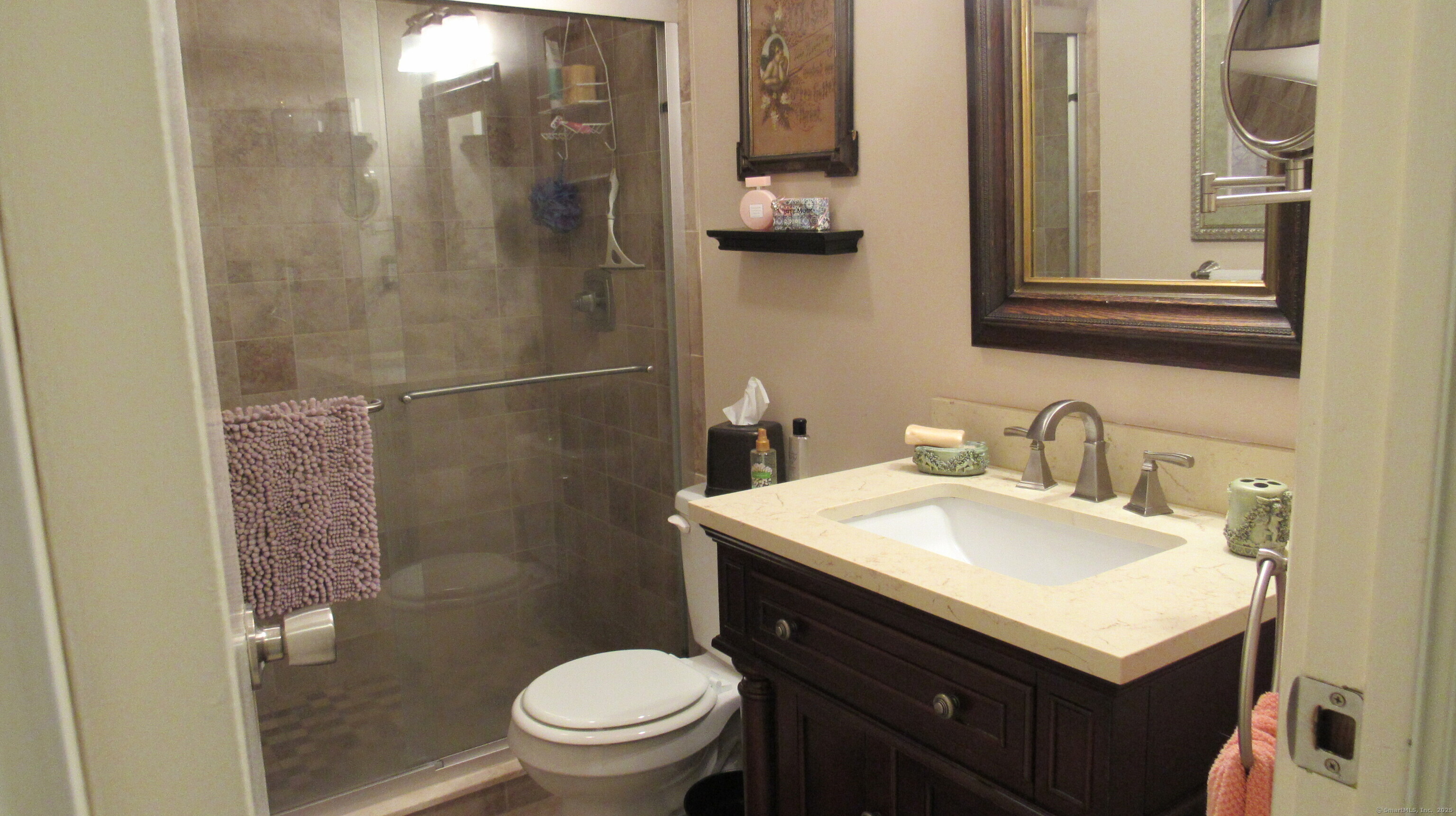 27 Surrey Lane, Unit 27 Torrington, CT 06790 - Photo 16 of 30 a bathroom with a sink toilet and mirror