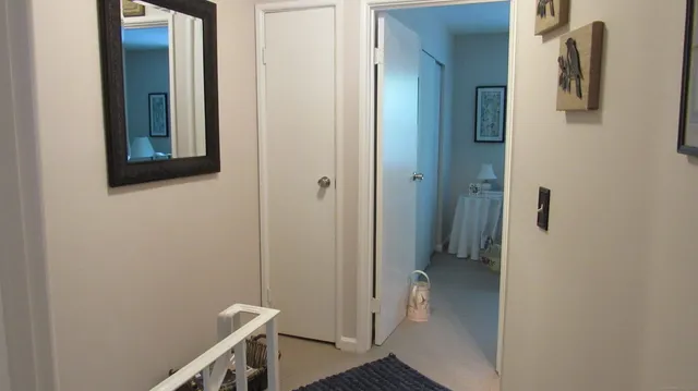 a view of a hallway with a room