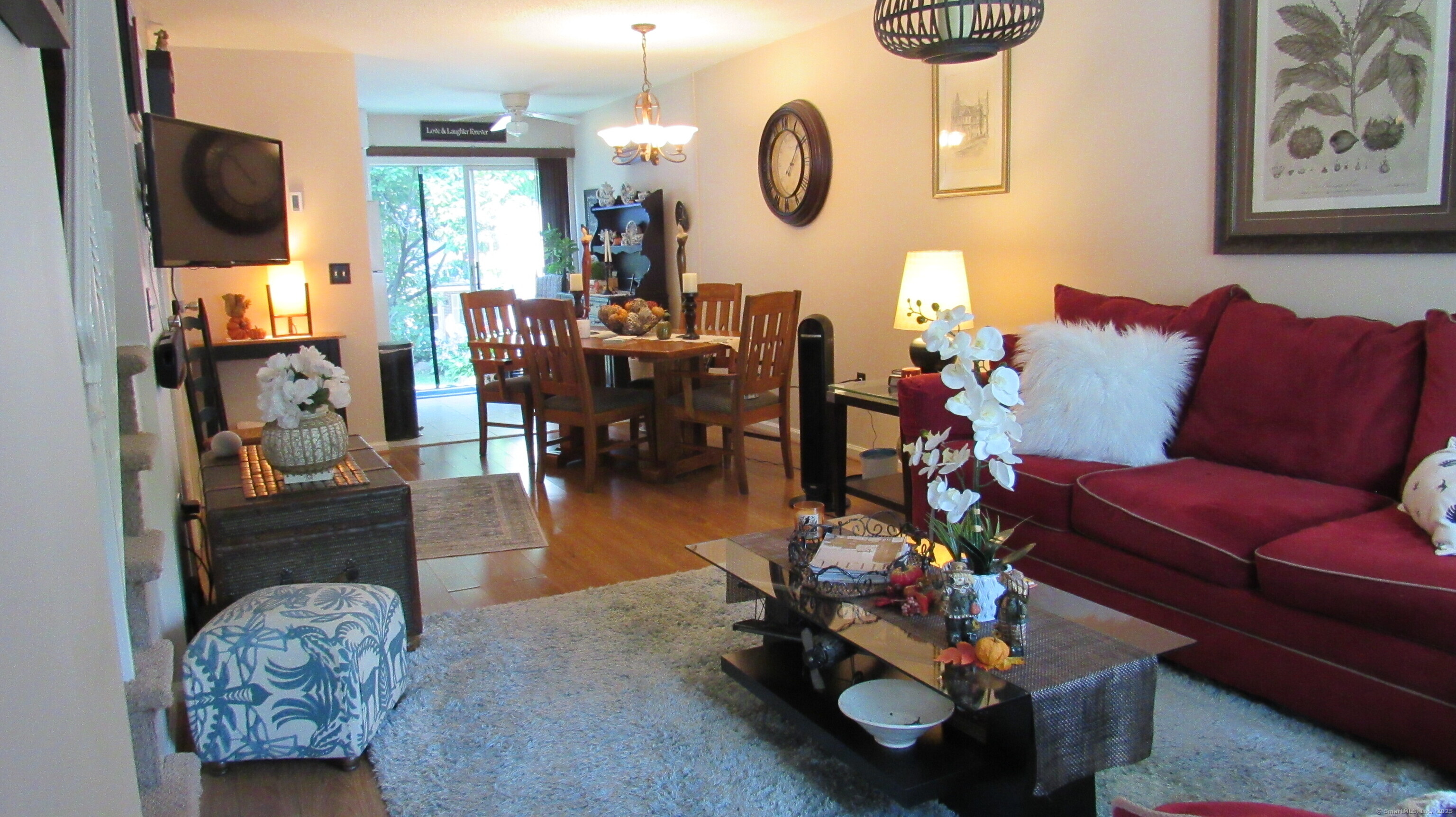 27 Surrey Lane, Unit 27 Torrington, CT 06790 - Photo 3 of 30 a living room with furniture a flat screen tv and a window