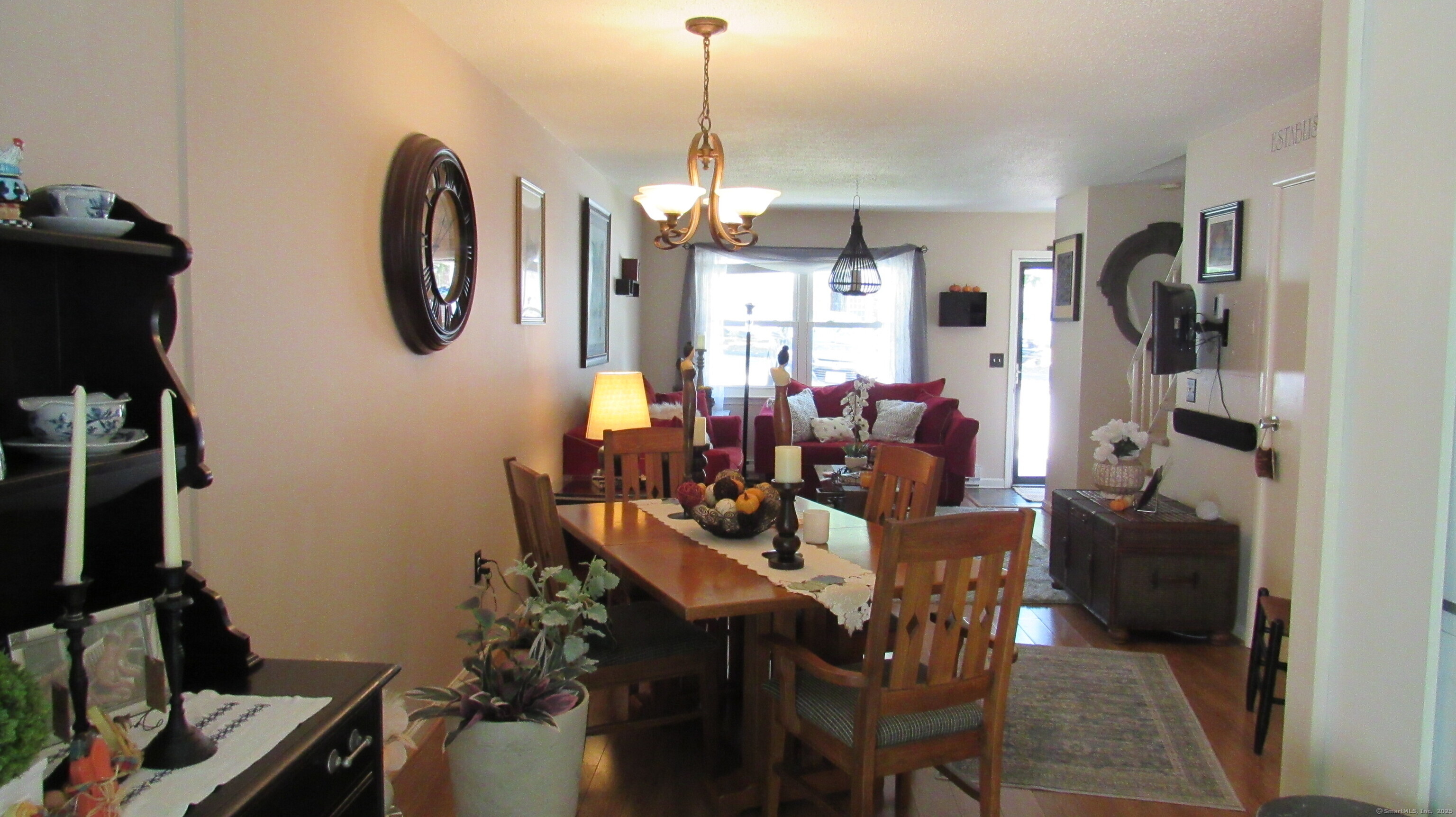 27 Surrey Lane, Unit 27 Torrington, CT 06790 - Photo 5 of 30 a view of a dining room with furniture window and wooden floor