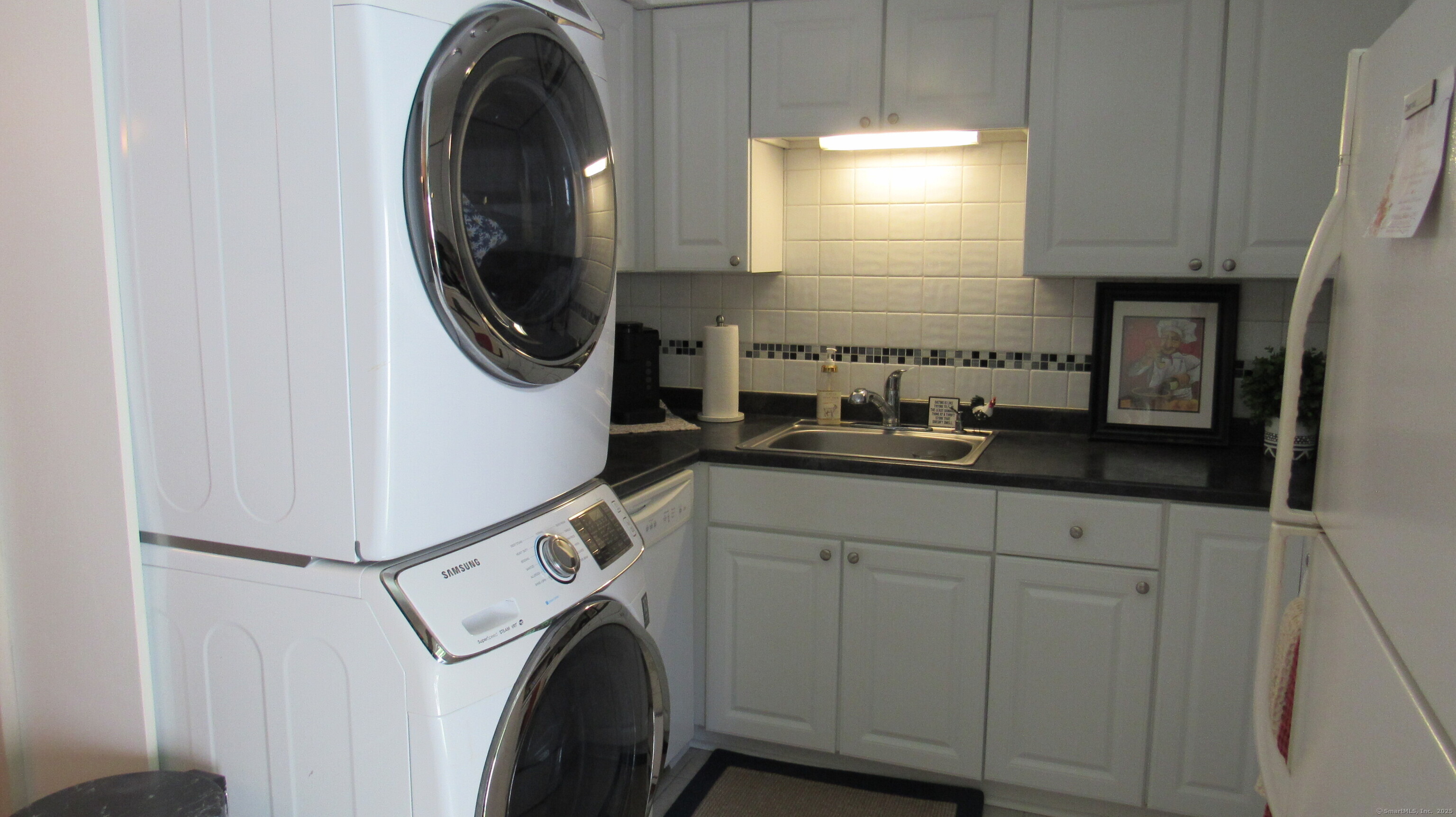 27 Surrey Lane, Unit 27 Torrington, CT 06790 - Photo 9 of 30 a utility room with dryer and washer