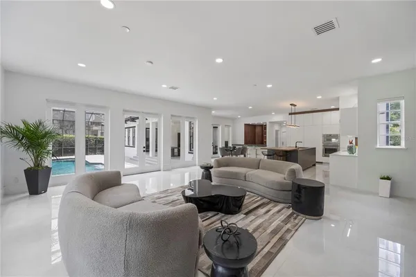 a view of a livingroom with furniture and front door