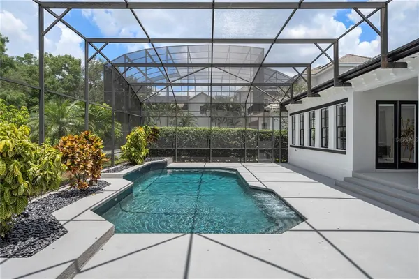 a view of a swimming pool with a patio