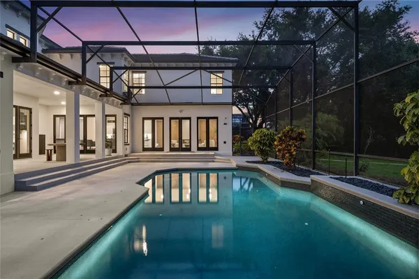 a swimming pool with yard outdoor seating and yard