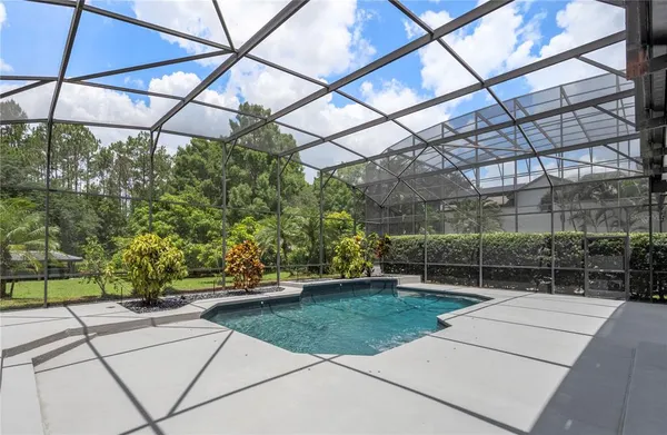 a view of a backyard with sitting area