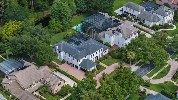 an aerial view of multiple houses with yard