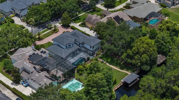 an aerial view of a house with a yard
