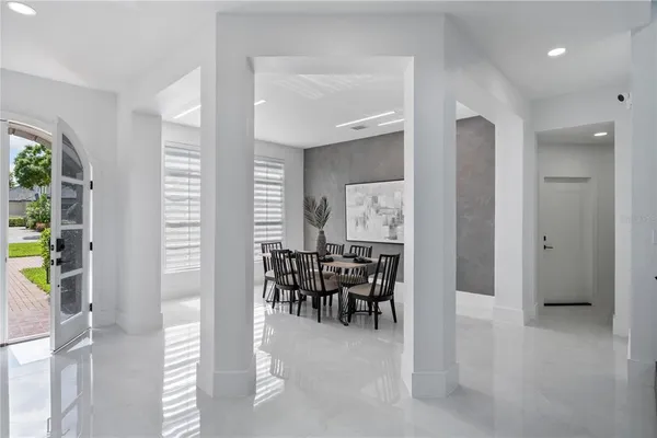 a view of a dining room with furniture and a window