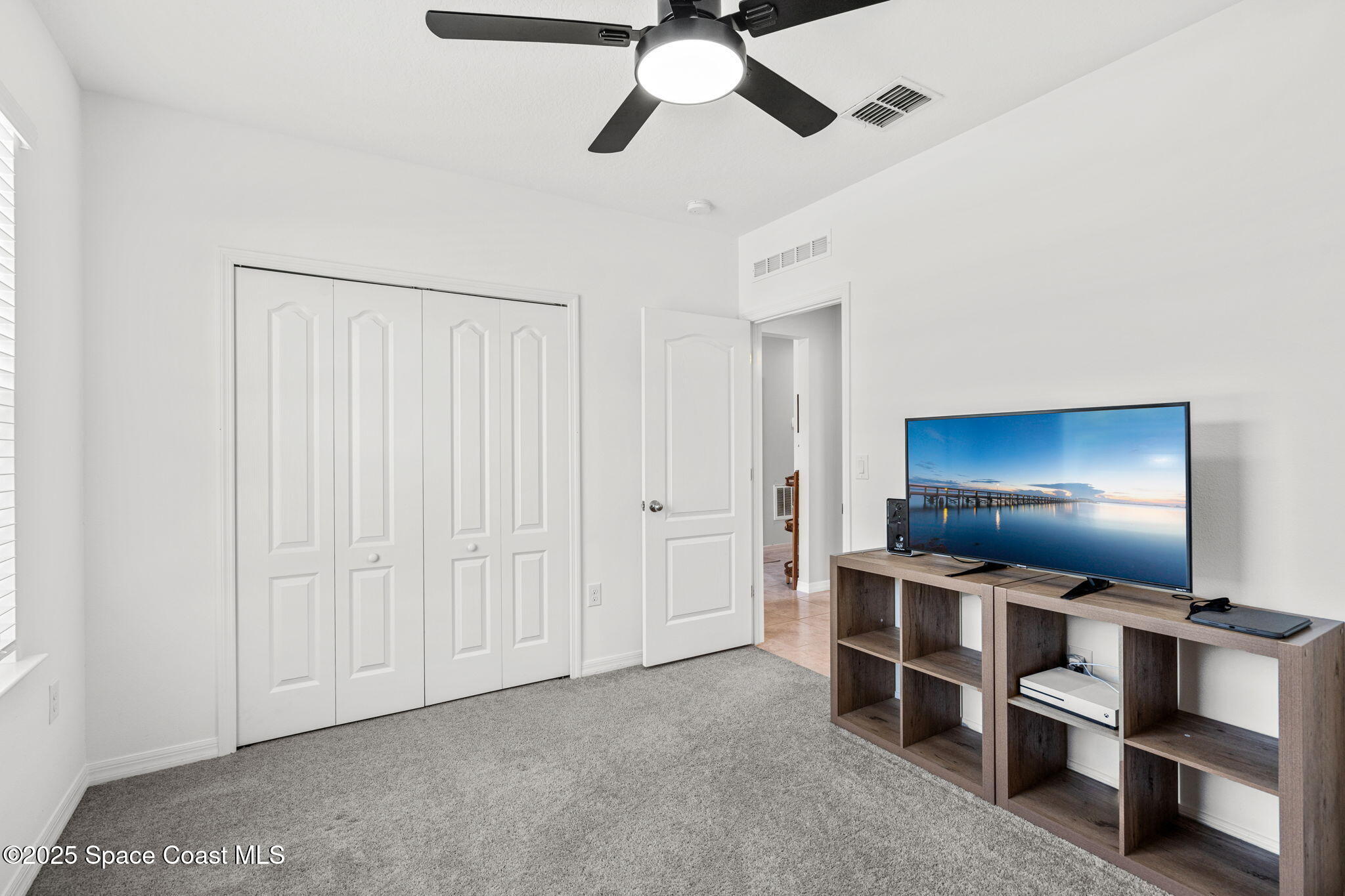 6162 Rena Avenue Cocoa, FL 32927 - Photo 21 of 42 a room with furniture and window