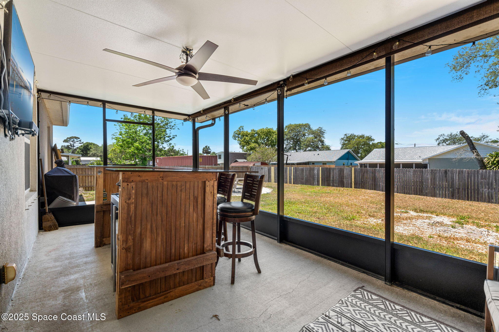 6162 Rena Avenue Cocoa, FL 32927 - Photo 25 of 42 a view of a living room and floor to ceiling window