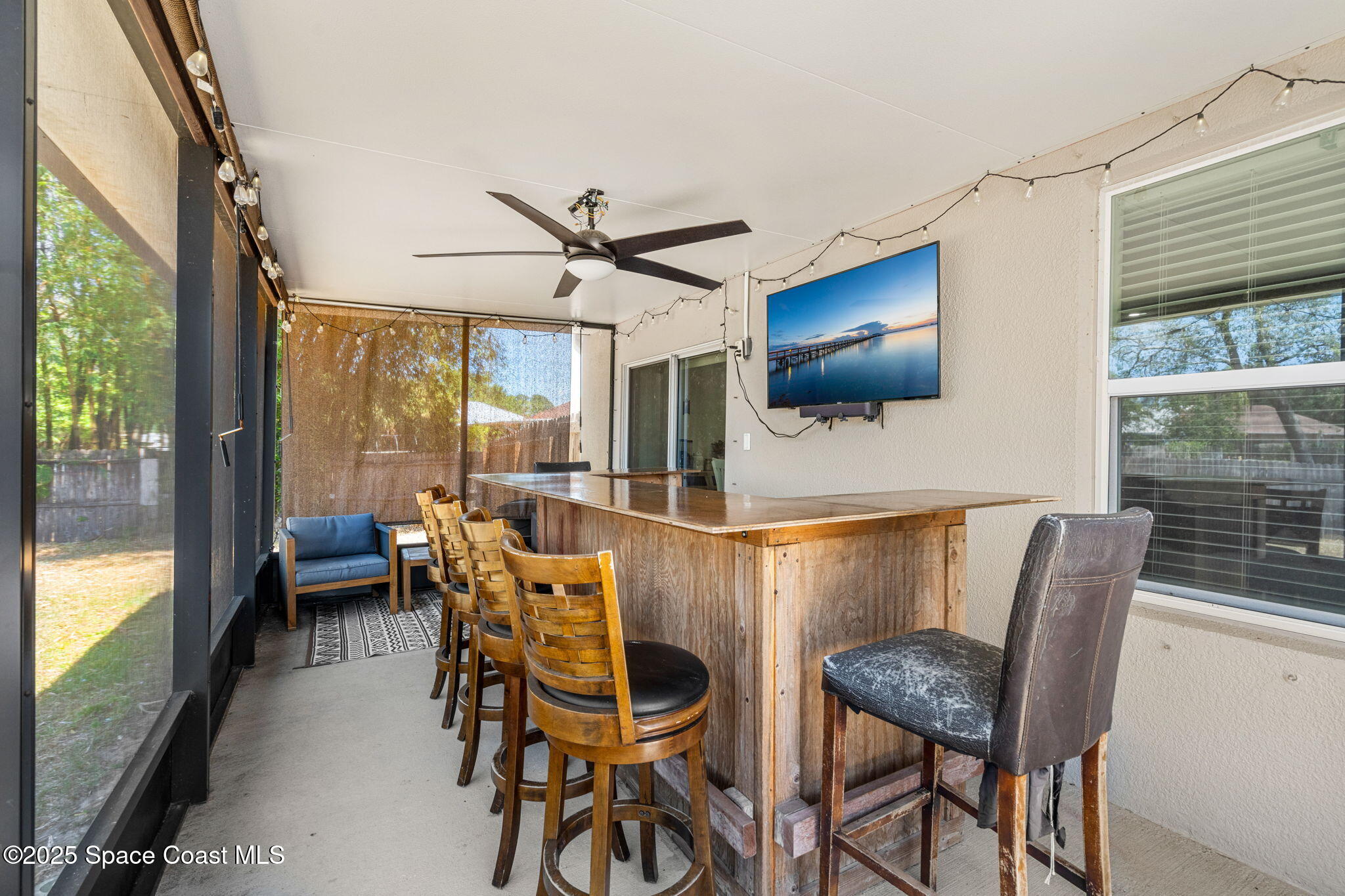 6162 Rena Avenue Cocoa, FL 32927 - Photo 26 of 42 a dining room with furniture and a floor to ceiling window