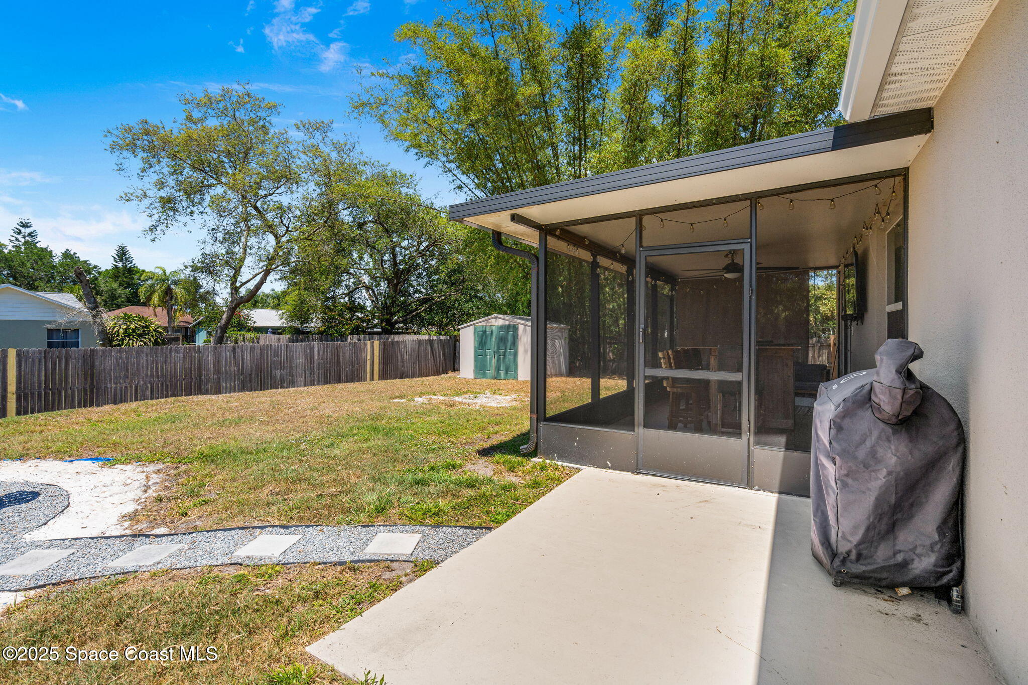 6162 Rena Avenue Cocoa, FL 32927 - Photo 27 of 42 a swimming pool with outdoor seating and yard